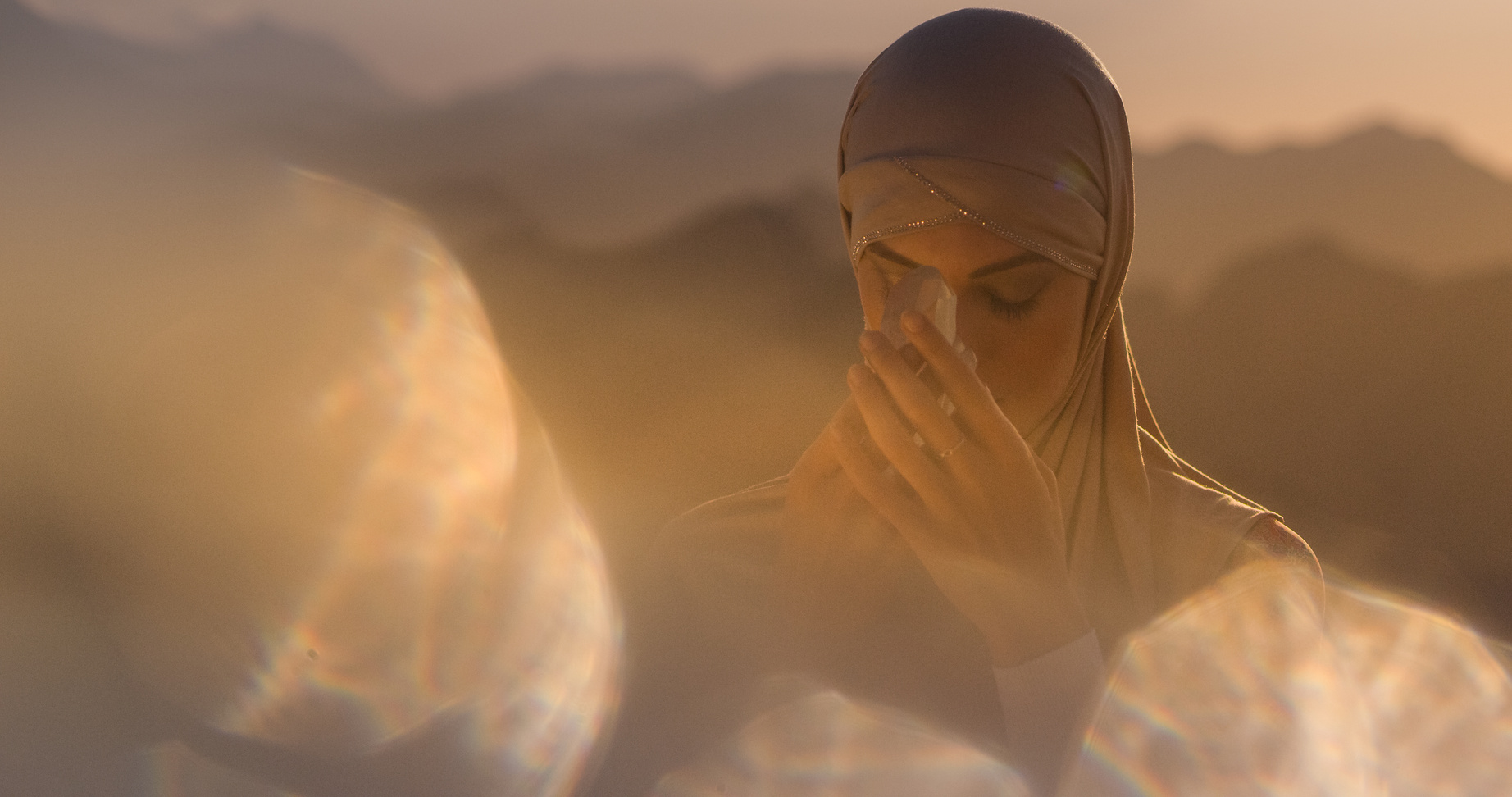 Muslim women holding healing crystals